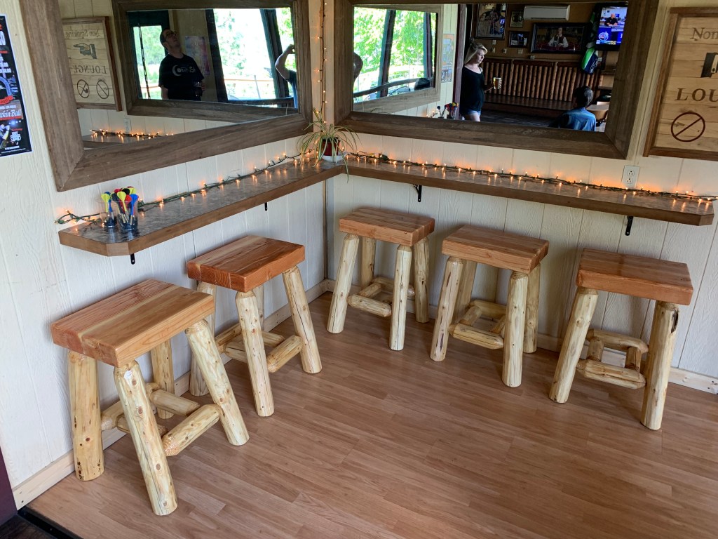 Handcrafted hardwood custom furniture piece on a wooden surface